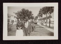 Esther Morgan and James Harvey Morgan in front of house